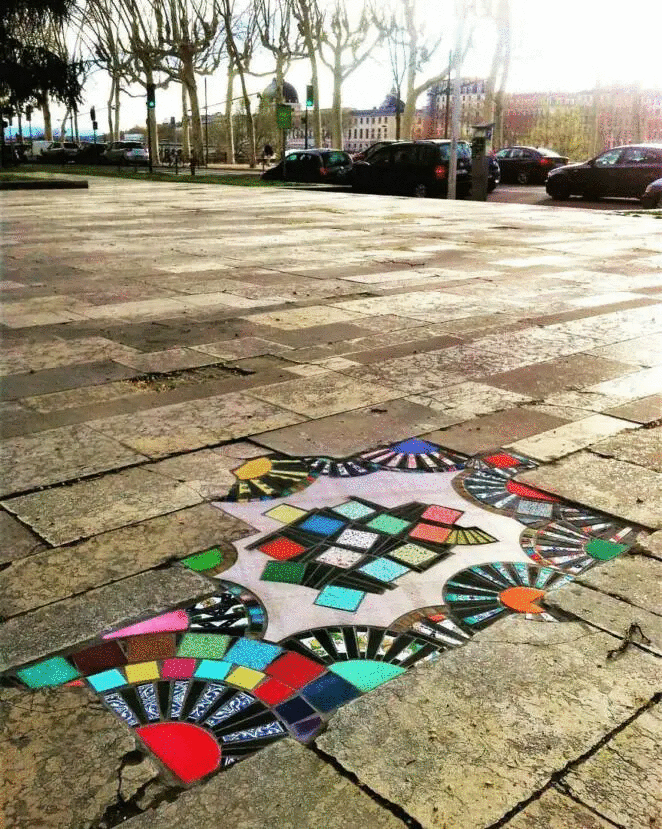 French Artist Turns Cracks in Pavements into Colorful Mosaics