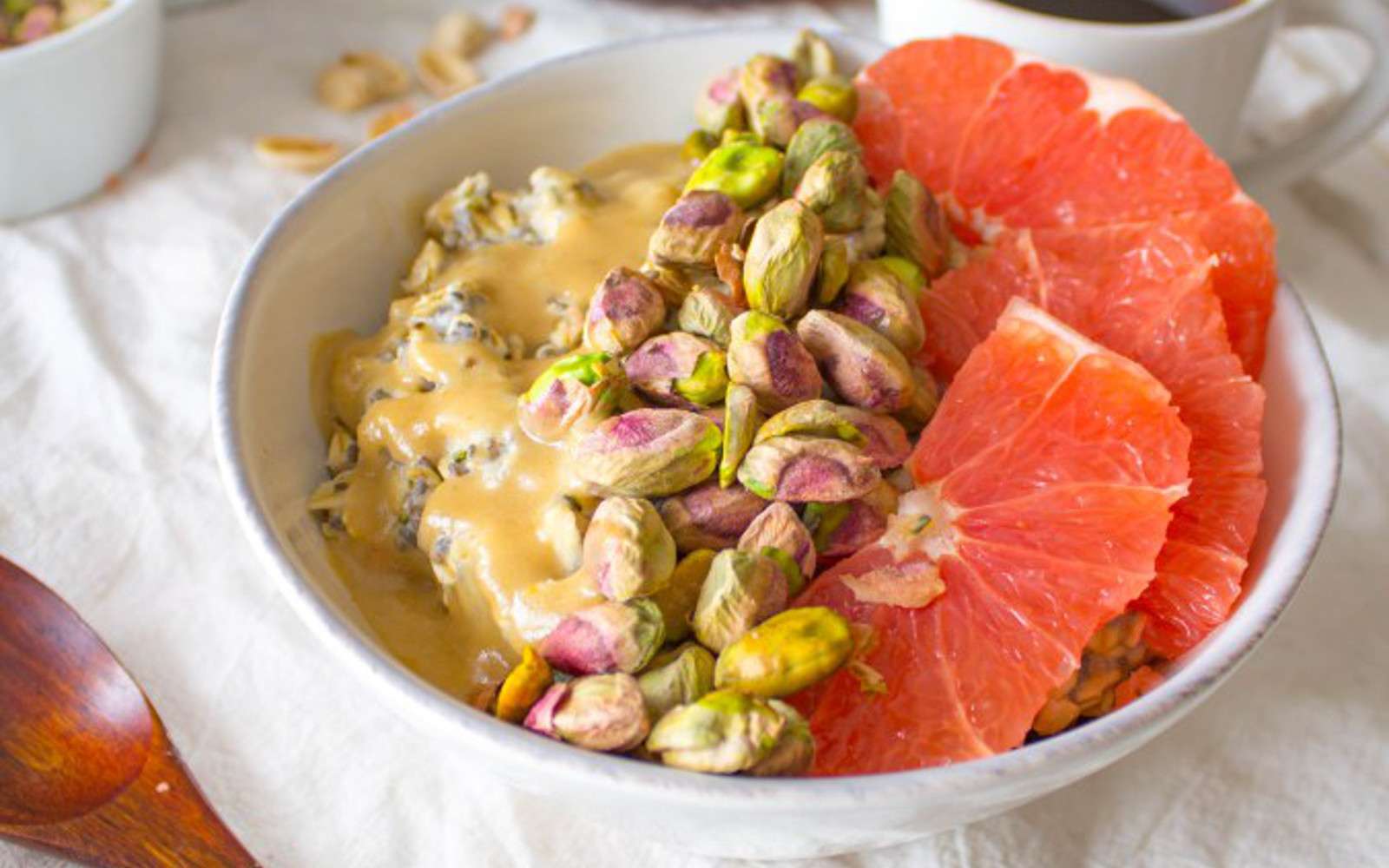 Breakfast Bowl With Oats, Pistachios, Grapefruit, and a Sweet Tahini Drizzle