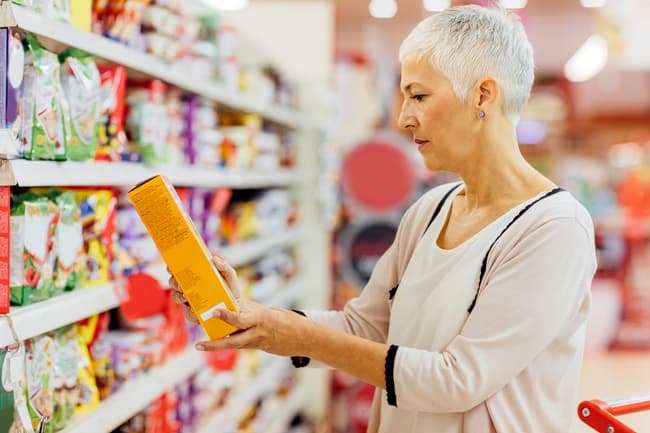 photo of person reading food label