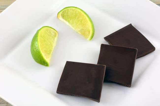 photo of pieces of dark chocolate and lime