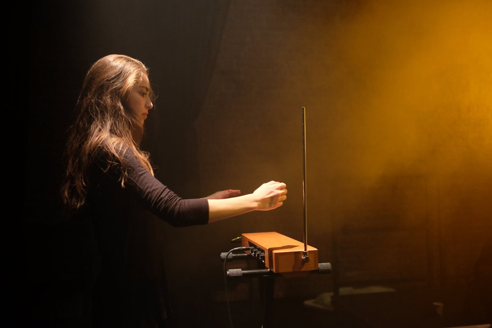 girl playing theremin